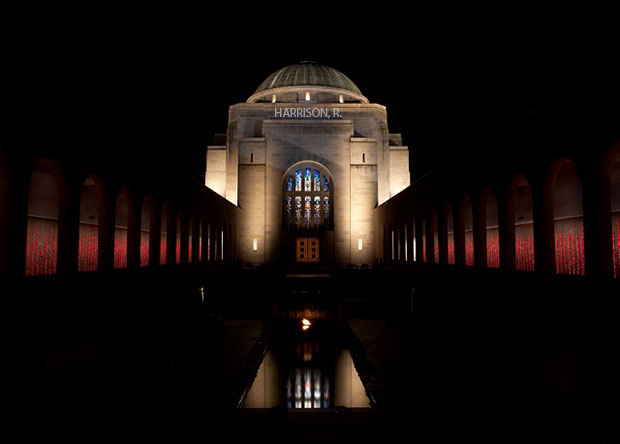 Harrison's name is projected on the Australian War Memorial at night.
