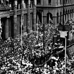Armistice celebrations in front of the Commonwealth Bank of Australia’s head office, Martin Place, Sydney, 12 November 1918. The centrepiece of the celebrations was the model destroyer HMAS Australia, which had been erected to promote the Seventh War Loan in September 1918. PN-000905