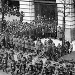 Edward, the Prince of Wales, takes the salute for Anzac Day outside Australia House, London, which housed a branch of the Commonwealth Bank of Australia, 25 April 1919. PN-000283