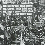 Sir James Joynton Smith, former Lord Mayor of Sydney, addresses the crowd on the opening day of the Second Peace Loan campaign, 6 August 1920. A banner in the background reads:‘WE Cried for men: THEY answered WE Cheered: THEY Sailed away WE Slept in peace: THEY Suffered  It’s OUR turn: WE MUST PAY!’ PN-001806