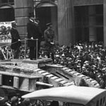 The Governor of New South Wales, Sir Walter Davidson, opens Tank Week outside the Commonwealth Bank of Australia’s head office, Moore Street (now Martin Place), Sydney. Sir Davidson’s address was followed by speeches from David Storey, Acting Minister for Public Health, and the Lord Mayor of Sydney, Alderman James Joynton Smith. The tank is a model of the Mark IV. PN-001740