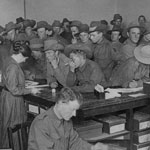Staff at work in the Military Department of the Commonwealth Bank of Australia Strand Branch, London. Owing to enlistments, and later, conscription, the members of staff were predominantly female. PN-002149