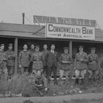 Staff outside the Commonwealth Bank of Australia Military Branch at Hurdcott, England, 27 June 1919. Near Salisbury Plain, this branch was opened in September 1918 along with an agency at Fovant, Wiltshire. PN-000220